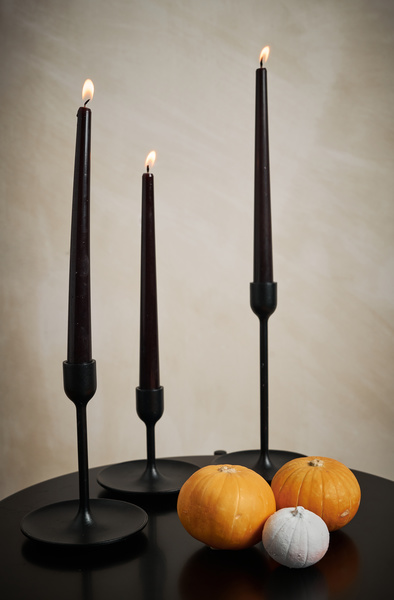 Table with Black Candles and Pumpkins